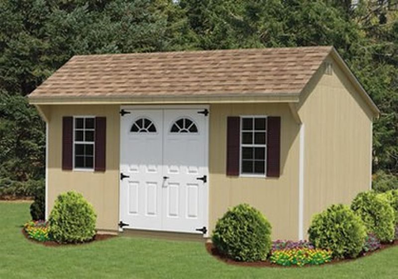 10x16 Transom Dormer Shed, Tan Duratemp siding, Dark Brown trim, Earthtone Cedar roof, shown with Dark Brown doors